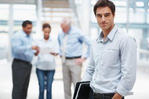 photodune-202599-smart-business-man-with-a-laptop-and-colleagues-at-the-back-s-300x200